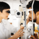 demo-attachment-1398-optometrist-examining-patient-in-modern-RXUVD5T